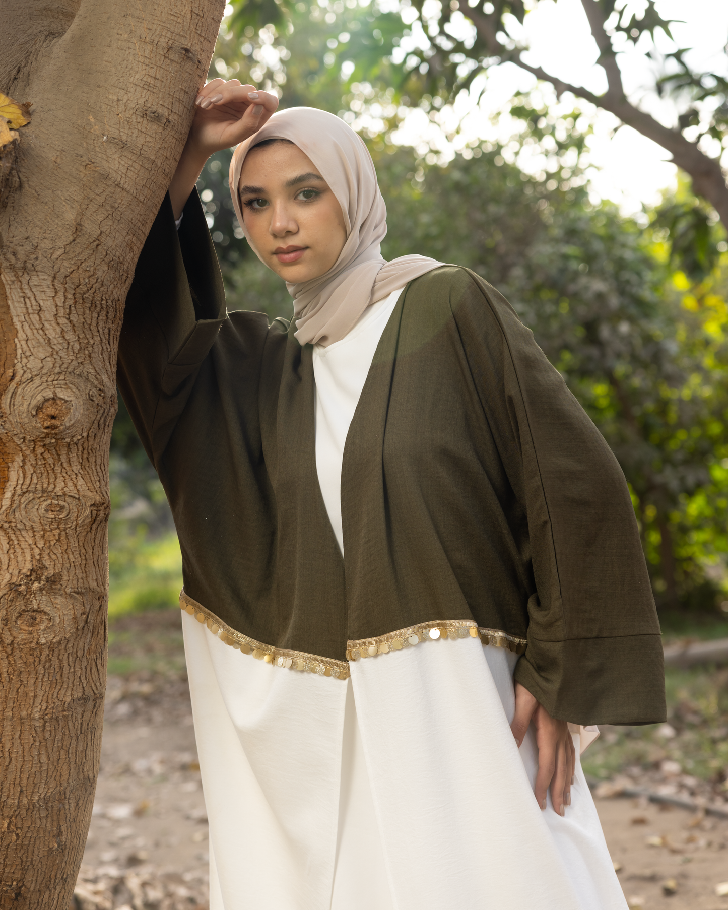 elegant Kaftan, beautifully crafted from premium linen fabric and adorned with exquisite embroidery. Code 110 olive