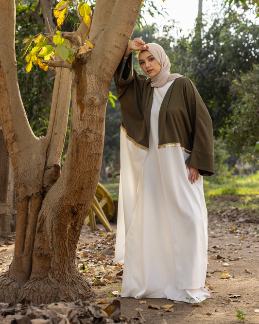 elegant Kaftan, beautifully crafted from premium linen fabric and adorned with exquisite embroidery. Code 110 olive