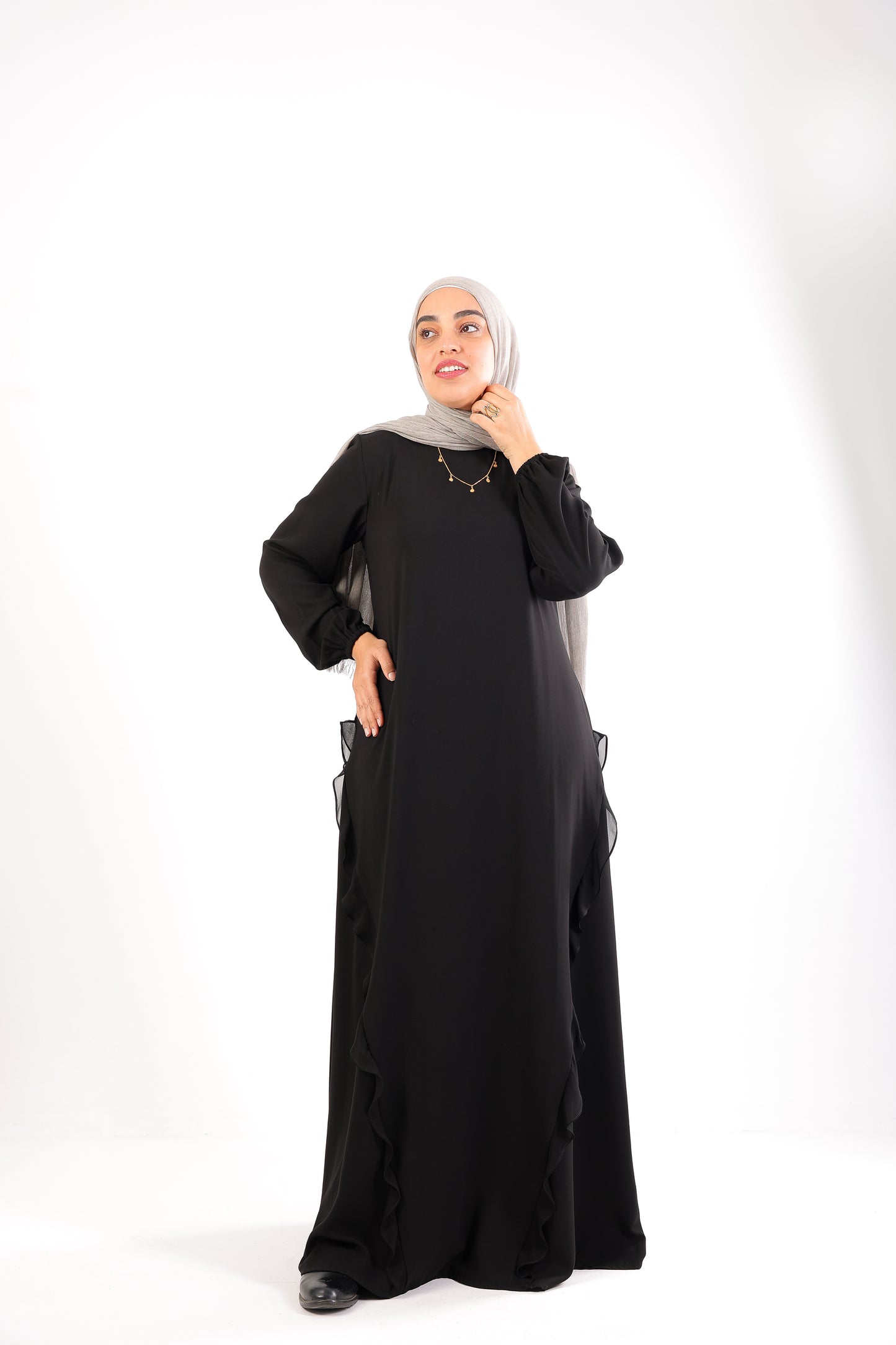 A chic, feminine abaya designed with soft ruffle details Code 504