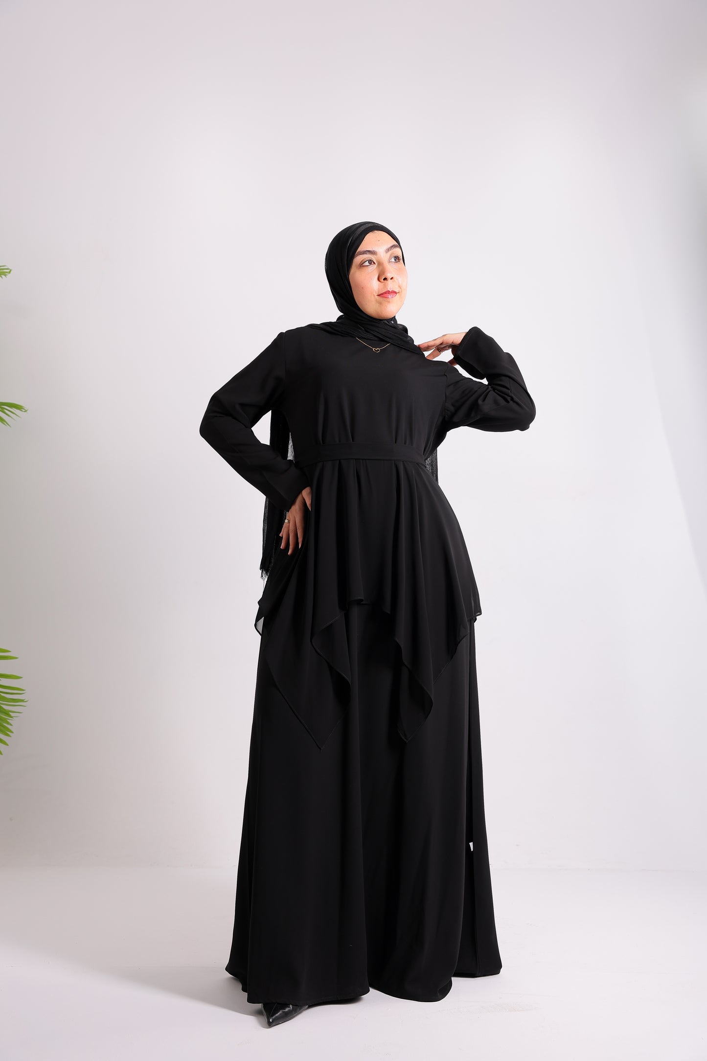 Lily crepe abaya is designed with delicate chiffon ruffles and a matching belt code 112 B
