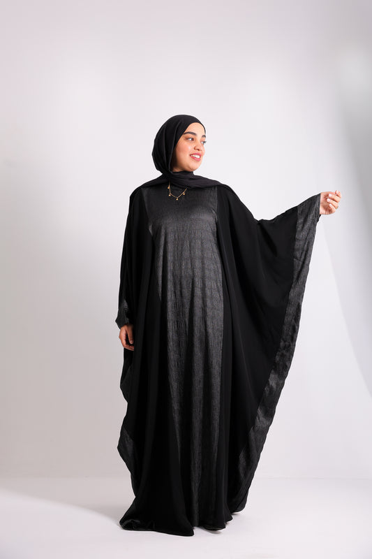 A luxurious silk abaya with embroidered silk accents, designed with an inner belt Code 405