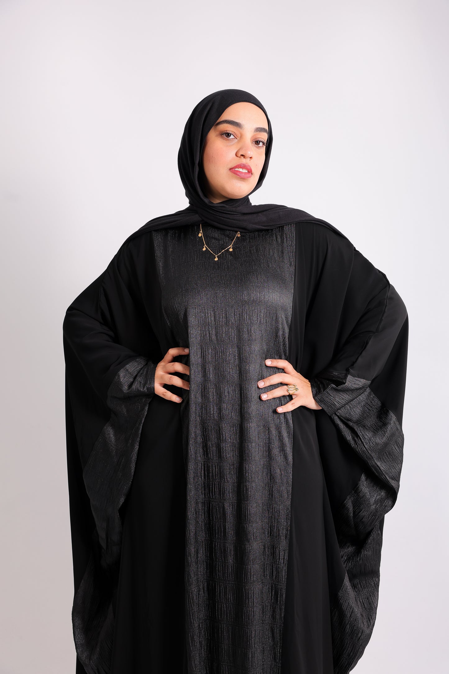 A luxurious silk abaya with embroidered silk accents, designed with an inner belt Code 405