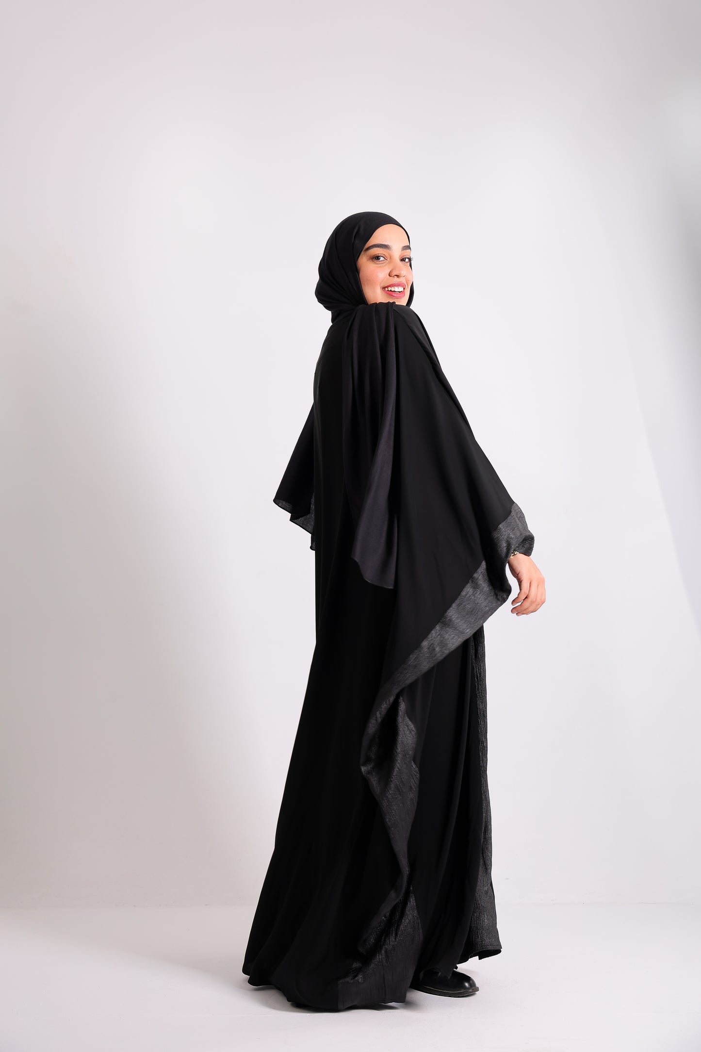 A luxurious silk abaya with embroidered silk accents, designed with an inner belt Code 405