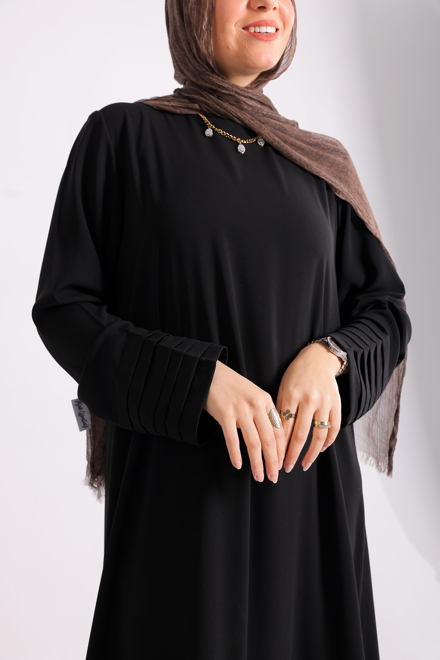 Soft crepe abaya with elegant pleated details on the sleeves and hem.Code 508