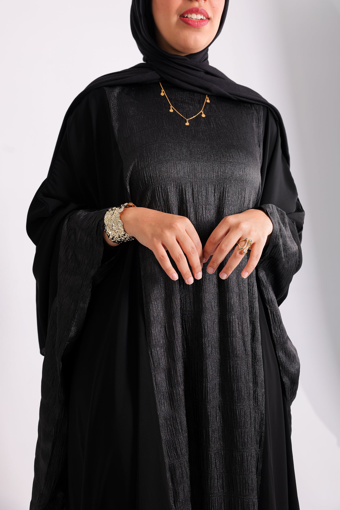A luxurious silk abaya with embroidered silk accents, designed with an inner belt Code 405