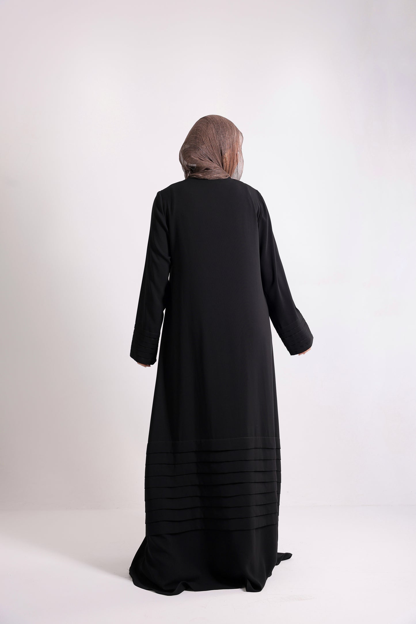 Soft crepe abaya with elegant pleated details on the sleeves and hem.Code 508