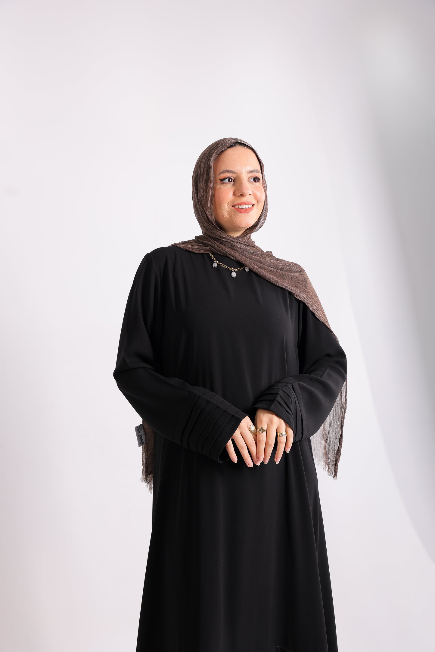 Soft crepe abaya with elegant pleated details on the sleeves and hem.Code 508